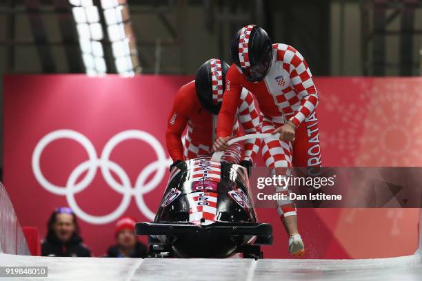 Drazen Silic and Benedikt Nikpalj of Croatia slide during two-man Bobsleigh heats on day nine of the PyeongChang 2018 Winter Olympic Games at Olympic...