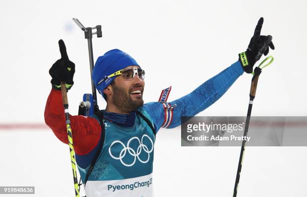 Martin Fourcade of France celebrates winning the gold medal during the Men's 15km Mass Start Biathlon on day nine of the PyeongChang 2018 Winter...