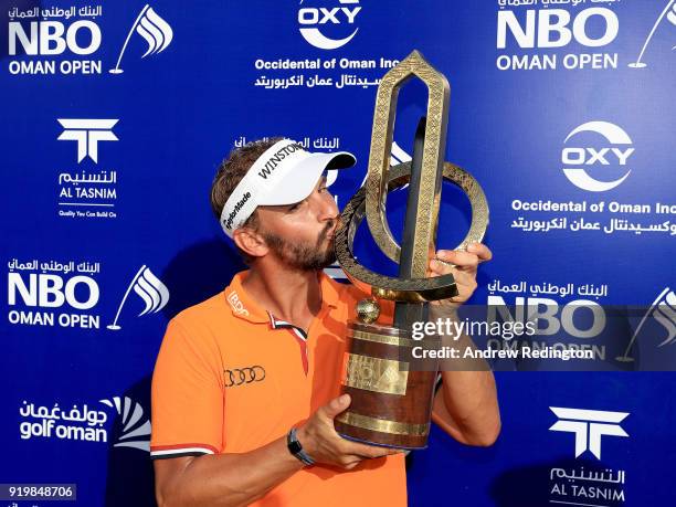 Joost Luiten of the Netherlands celebrates with the winners trophy after the final round of the NBO Oman Open at Al Mouj Golf on February 18, 2018 in...