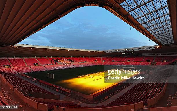 Artificial lights are used to keep the grass in top condition after the Barclays Premier League match between Sunderland and Liverpool at the Stadium...