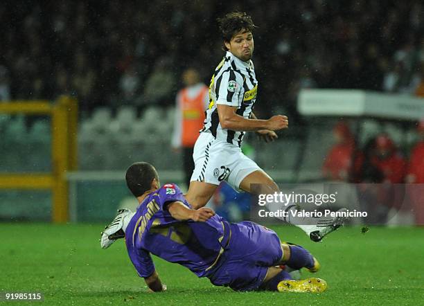 Ribas Da Cunha Diego of Juventus FC is challenged by Alessandro Gamberini of ACF Fiorentina during the Serie A match between Juventus FC and ACF...