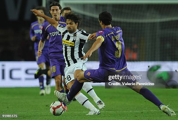 Ribas Da Cunha Diego of Juventus FC is challenged by Dario Dainelli of ACF Fiorentina during the Serie A match between Juventus FC and ACF Fiorentina...