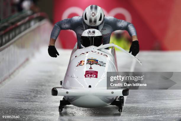 Oskars Kibermanis and Matiss Miknis of Latvia slide during two-man Bobsleigh heats on day nine of the PyeongChang 2018 Winter Olympic Games at...