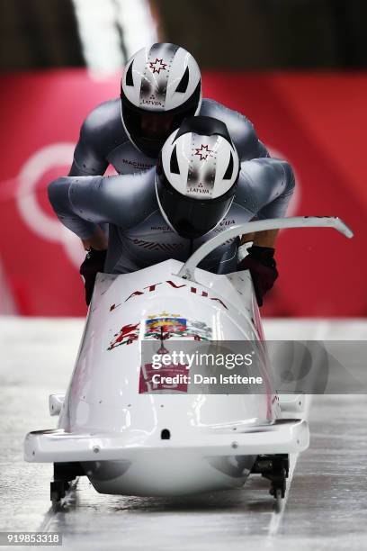 Oskars Melbardis and Janis Strenga of Latvia slide during two-man Bobsleigh heats on day nine of the PyeongChang 2018 Winter Olympic Games at Olympic...