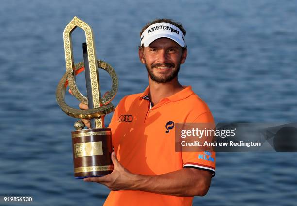 Joost Luiten of the Netherlands celebrates with the winners trophy after the final round of the NBO Oman Open at Al Mouj Golf on February 18, 2018 in...
