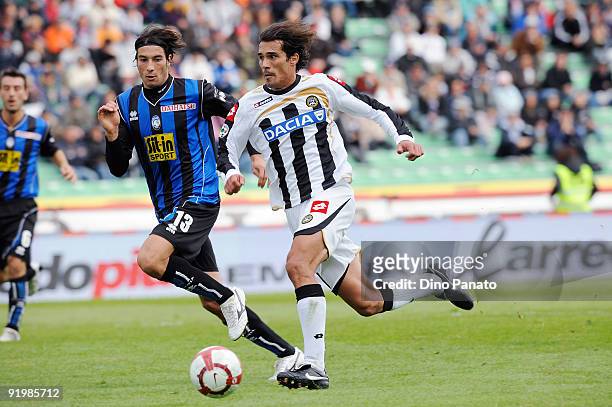 Bernardo Corradi of Udinese Calcio competes in thr air with Maximiliano Pellegrino of Atalanta BC during the Serie A match between Udinese Calcio and...