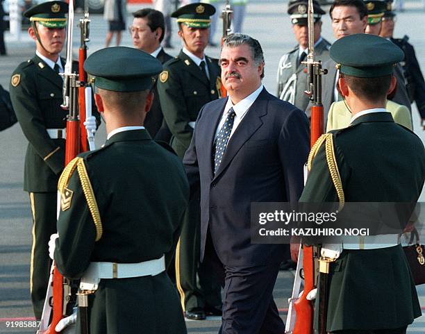 Lebanese Prime Minister Rafic Hariri inspects a guard of honor as he arrives at Tokyo's Haneda Airport 03 November. Hariri is on a four-day official...