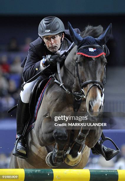 Third placed Eric Van der Vleuten of Netherlands and and his horse VLD Groep Tomboy jump over a fence during the FEI World Cup International Jumping...