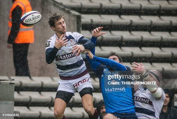 Bordeaux-Begles' Baptiste Serin vies with Castres' players during the French Top 14 rugby union match between Union Bordeaux-Begles and Castres at...