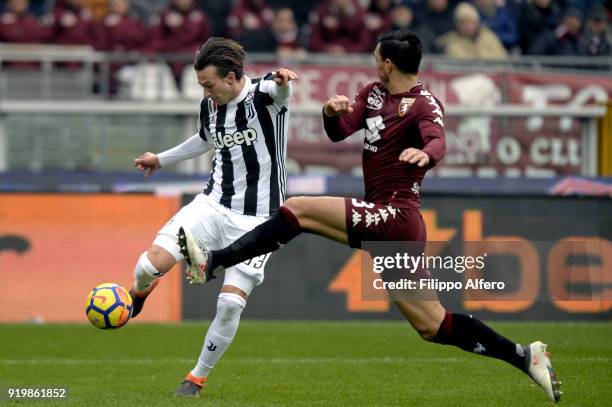 Federico Bernardeschi of Juventus and Nicolas Burdisso of Torino during the serie A match between Torino FC and Juventus at Stadio Olimpico di Torino...