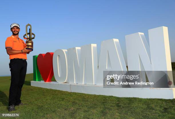 Joost Luiten of the Netherlands celebrates with the winners trophy after the final round of the NBO Oman Open at Al Mouj Golf on February 18, 2018 in...