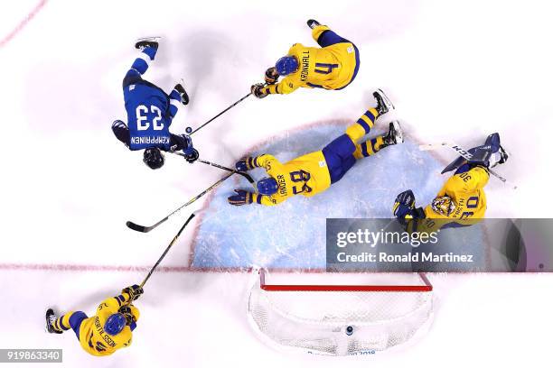 Anton Lander of Sweden dives to block a shot by Joonas Kemppainen of Finland in the second period during the Men's Ice Hockey Preliminary Round Group...
