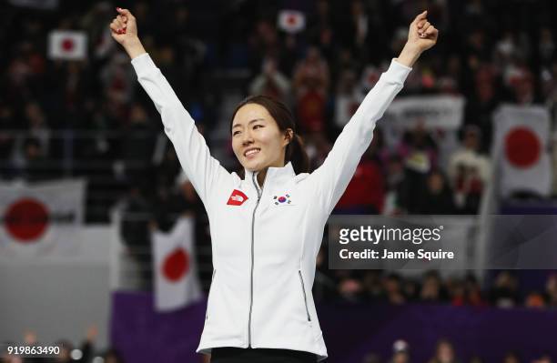 Silver medalist Sang-Hwa Lee of Korea celebrates during the victory ceremony after the Ladies' 500m Individual Speed Skating Final on day nine of the...