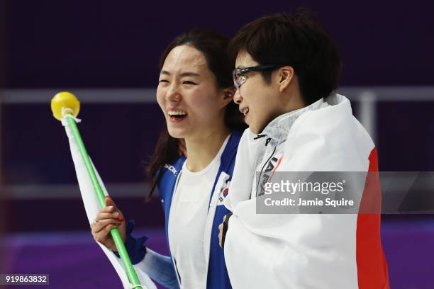 Silver medalist Sang-Hwa Lee of Korea and gold medalist Nao Kodaira of Japan celebrate after the Ladies' 500m Individual Speed Skating Final on day...