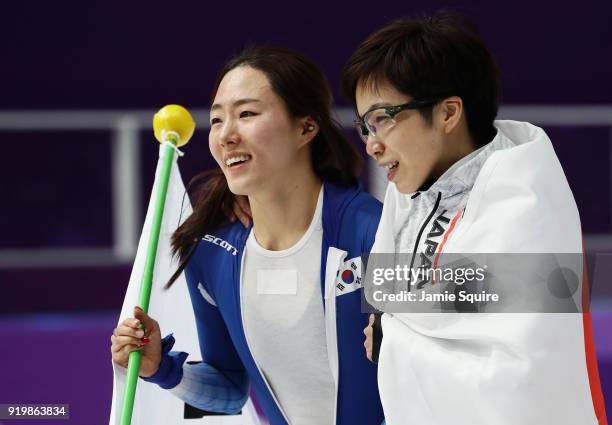 Silver medalist Sang-Hwa Lee of Korea and gold medalist Nao Kodaira of Japan celebrate after the Ladies' 500m Individual Speed Skating Final on day...