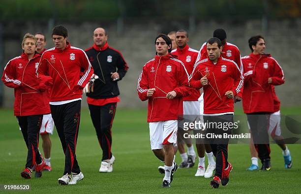 New signing Alberto Aquilani of Liverpool takes a light jog next to Javier Mascherano during training prior to the UEFA Champions League Group E...