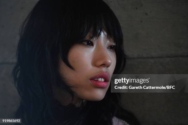 Model backstage ahead of the Roland Mouret show during London Fashion Week February 2018 at The National Theatre on February 18, 2018 in London,...