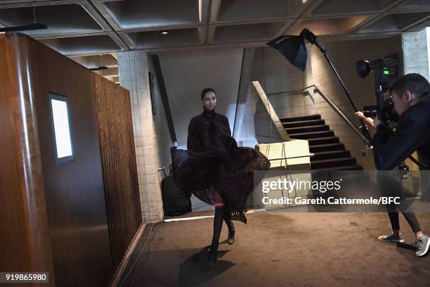 Model backstage ahead of the Roland Mouret show during London Fashion Week February 2018 at The National Theatre on February 18, 2018 in London,...