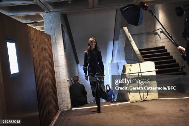 Model backstage ahead of the Roland Mouret show during London Fashion Week February 2018 at The National Theatre on February 18, 2018 in London,...