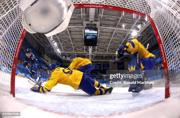 Anton Lander of Sweden dives to block a shot by Joonas Kemppainen of Finland in the second period during the Men's Ice Hockey Preliminary Round Group...