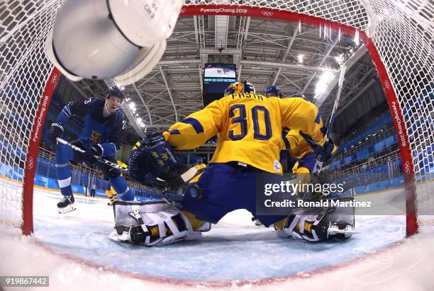 Joonas Kemppainen of Finland scores a goal in the second period against Viktor Fasth of Sweden during the Men's Ice Hockey Preliminary Round Group C...