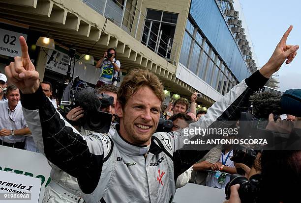 British Formula One driver Jenson Button of Brawn GP celebrates winning the F1 World Championship at the end of Brazil's Formula 1 GP, October 18 at...