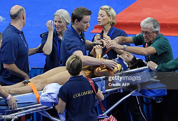 Colombia's Jessica Gil Ortiz is taken away by paramedics after falling during the floor event in the apparatus finals during the Artistic Gymnastics...