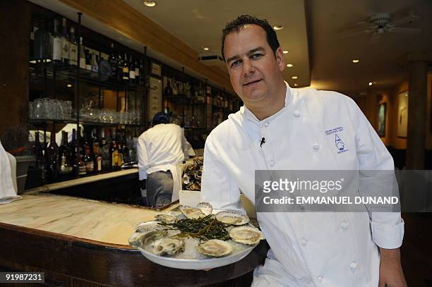 New York oyster bar "Aquagrill " owner and chef Jeremy Marshall displays an oyster platter at his restaurant in New York October 15, 2009. From...