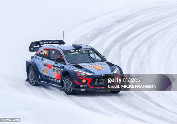 Thierry Neuville and his co-driver Nicolas Gilsoul of Belgium drive their Hyundai i20 Coupe WRC car to win the Rally Sweden 2018 as part of the World...