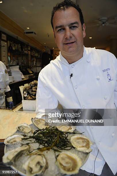 New York oyster bar "Aquagrill " owner and chef Jeremy Marshall displays an oyster platter at his restaurant in New York October 15, 2009. From...