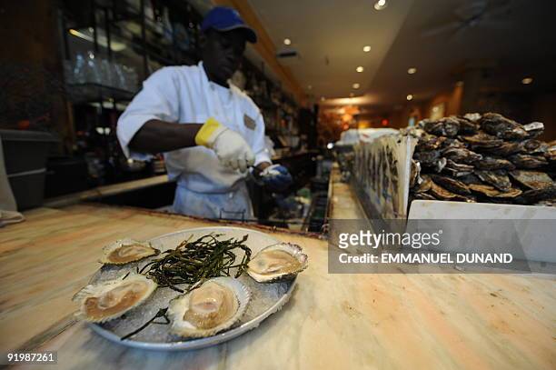 An oyster platter is prepared at New York oyster bar "Aquagrill " in New York October 15, 2009. Consumed on every street corner in the nineteenth...