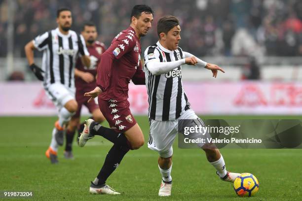 Nicolas Burdisso of Torino FC competes with Paulo Dybala of Juventus during the Serie A match between Torino FC and Juventus at Stadio Olimpico di...