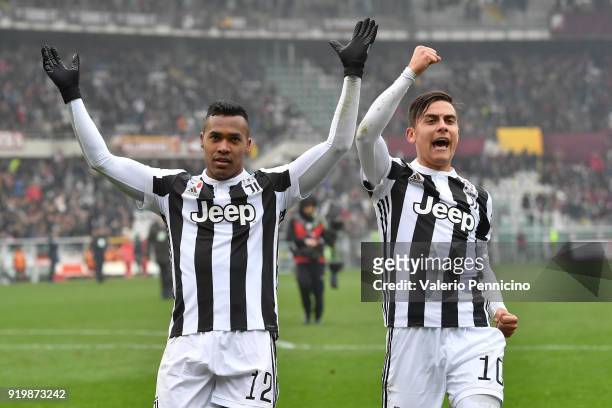 Alex Sandro and Paulo Dybala of Juventus celebrate victory at the end of the Serie A match between Torino FC and Juventus at Stadio Olimpico di...