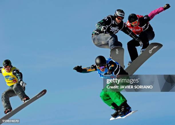 Australian Allex Pullin , US Nate Holland , US Seth Wescott and Italian Luca Matteotti compete in the Border Cross men final of the FIS Snowboarding...