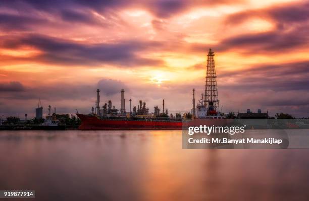 beautiful sunrise with oil refinery industry reflection. oil refinery on beautiful sky. oil refinery produces gasoline. - refine stock pictures, royalty-free photos & images