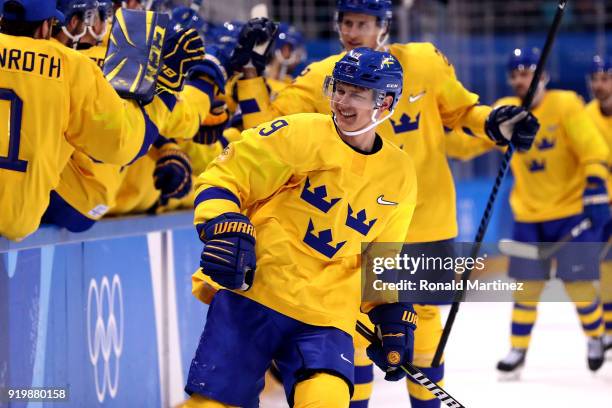 Patrik Zackrisson of Sweden celebrates with teammates after scoring a goal in the third period against Finland during the Men's Ice Hockey...