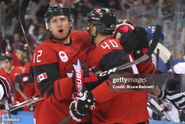 Maxim Lapierre of Canada celebrates with Rob Klinkhammer after scoring a goal on Matt Dalton of Korea in the third period during the Men's Ice Hockey...