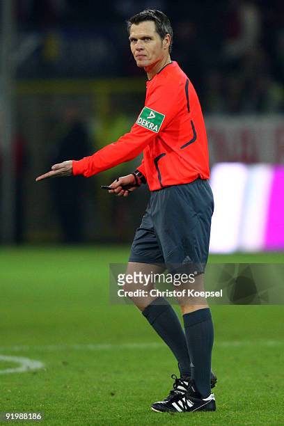 Referee Michael Weiner issues instructions to the team during the Bundesliga match between Borussia Dortmund and VfL Bochum at the Signal Iduna Park...