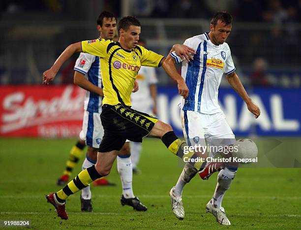 Damien Le Tallec of Dortmund tackles Christoph Dabrowski of Bochum during the Bundesliga match between Borussia Dortmund and VfL Bochum at the Signal...