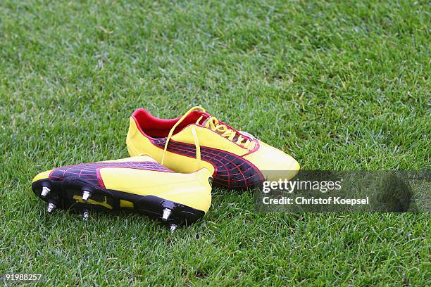 Football boots lie on the pitch during the Bundesliga match between VfB Stuttgart and FC Schalke 04 at the Mercedes-Benz Arena on October 17, 2009 in...