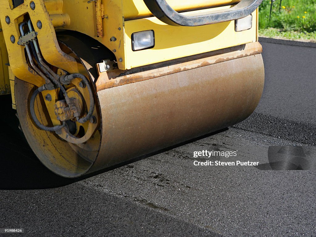 Steam roller paving asphalt road