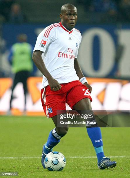 Guy Demel of Hamburg runs with the ball during the Bundesliga match between Hamburger SV and Bayer Leverkusen at the HSH Nordbank Arena on October...