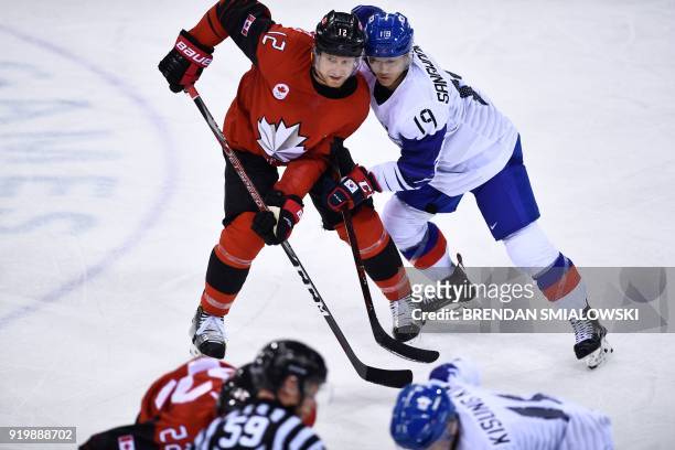 Canada's Rob Klinkhammer and South Korea's Kim Sangwook clash in the men's preliminary round ice hockey match between Canada and South Korea during...