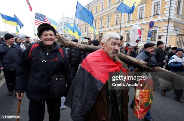 Supporters of former President of Georgia and former Odessa Governor Mikheil Saakashvili attend a march with demand of impeachment of Ukrainian...