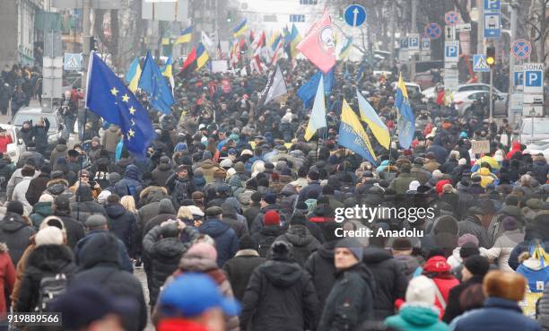 Supporters of former President of Georgia and former Odessa Governor Mikheil Saakashvili attend a march with demand of impeachment of Ukrainian...