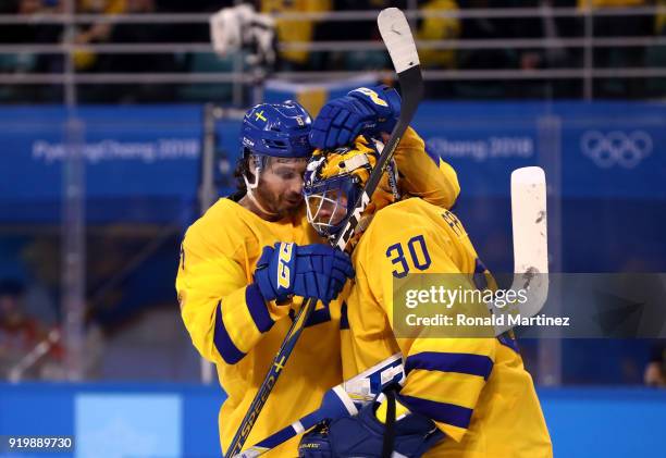 Johan Fransson and Viktor Fasth of Sweden celebrate after defeating Finland 3-1 during the Men's Ice Hockey Preliminary Round Group C game on day...