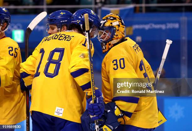 Dennis Everberg and Viktor Fasth of Sweden react after defeating Finland 3-1 during the Men's Ice Hockey Preliminary Round Group C game on day nine...