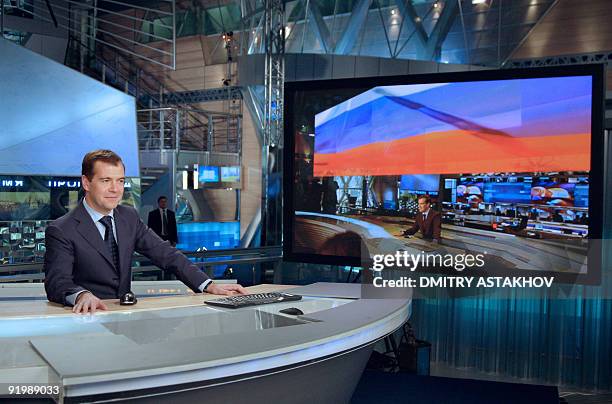 Picture taken on October 7, 2009 shows Russian President Dmitry Medvedev sitting behind a desk while recording of a talk show called "A Conversation...