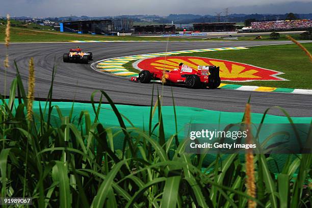 Kimi Raikkonen of Finland and Ferrari drives during the Brazilian Formula One Grand Prix at the Interlagos Circuit on October 18, 2009 in Sao Paulo,...