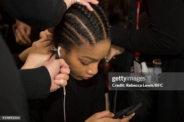 Model backstage ahead of the Preen by Thornton Bregazzi show during London Fashion Week February 2018 at on February 18, 2018 in London, England.